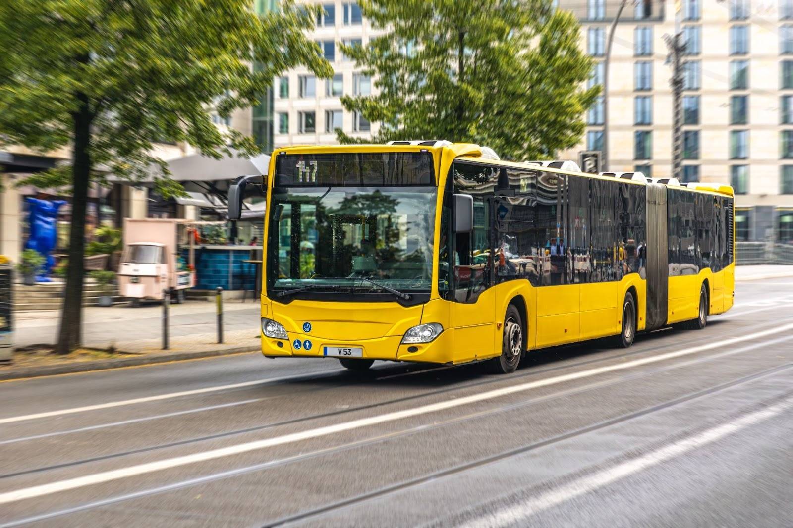 Bus export process illustration showing commercial buses being inspected, documented, and loaded for international shipping from Dubai